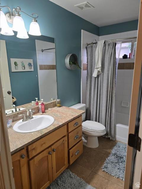 12075 S Draper Ridge Dr, Draper, UT 84020 - bathroom featuring visible vents, shower / bath combo with shower curtain, toilet, tile patterned floors, and vanity