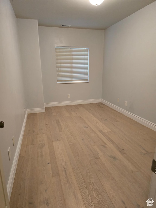 12075 S Draper Ridge Dr, Draper, UT 84020 - spare room with baseboards, light wood-type flooring, and visible vents