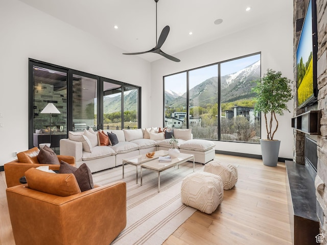 897 S Summit Creek Dr, Woodland Hills, UT 84653 - living room with recessed lighting, light wood-style flooring, a ceiling fan, and a fireplace