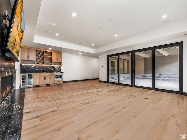 897 S Summit Creek Dr, Woodland Hills, UT 84653 - unfurnished living room featuring recessed lighting, a large fireplace, and wine cooler