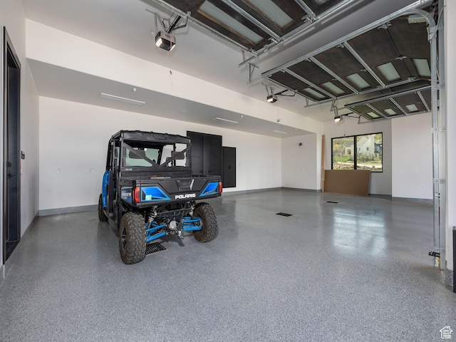 897 S Summit Creek Dr, Woodland Hills, UT 84653 - garage with electric panel, a garage door opener, and baseboards