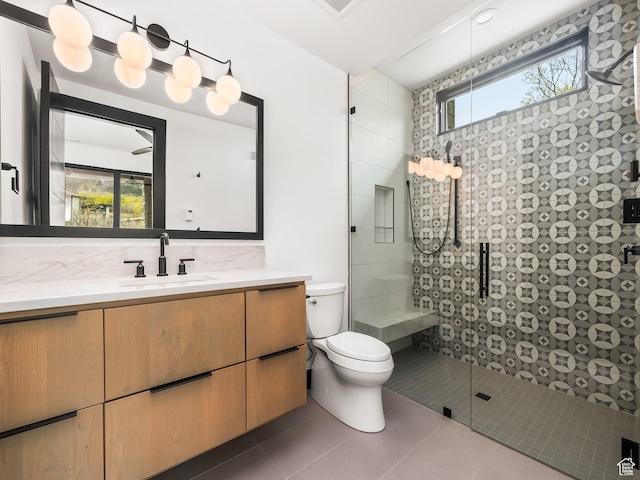 897 S Summit Creek Dr, Woodland Hills, UT 84653 - full bathroom with a tile shower, toilet, tile patterned flooring, and a healthy amount of sunlight