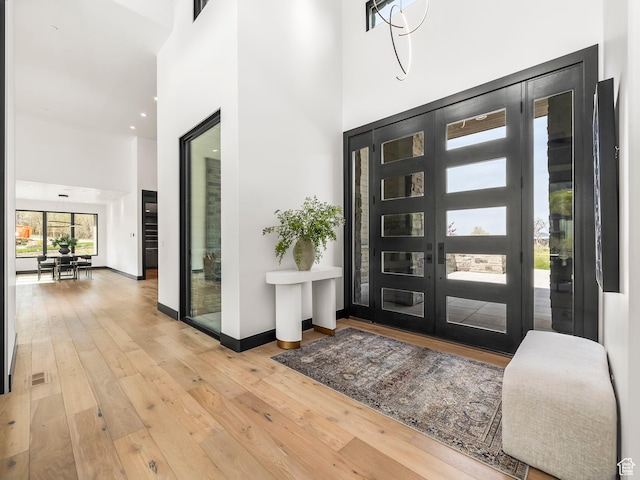 897 S Summit Creek Dr, Woodland Hills, UT 84653 - entryway with hardwood / wood-style floors, baseboards, and a high ceiling