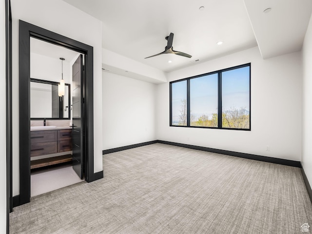 897 S Summit Creek Dr, Woodland Hills, UT 84653 - unfurnished bedroom with baseboards, recessed lighting, light carpet, and a sink