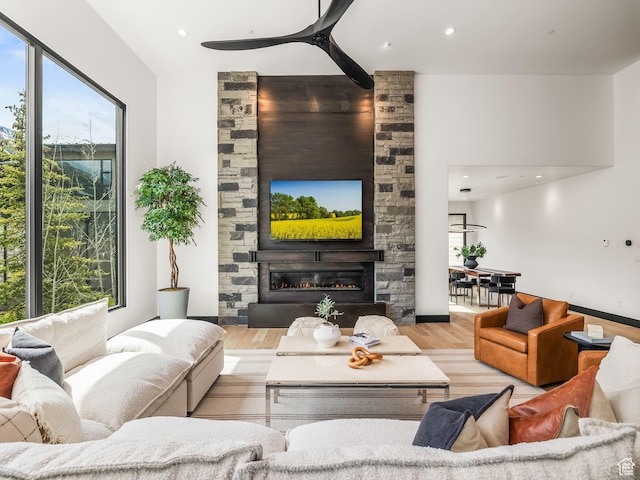 897 S Summit Creek Dr, Woodland Hills, UT 84653 - living room featuring a fireplace, wood finished floors, and plenty of natural light