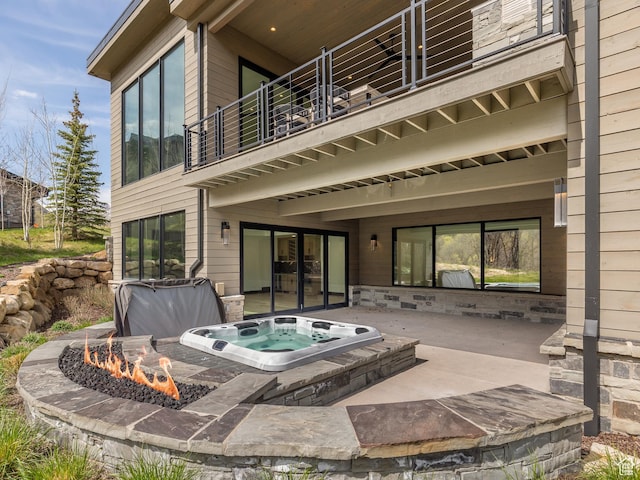 897 S Summit Creek Dr, Woodland Hills, UT 84653 - rear view of house featuring an outdoor hot tub, a patio, and a balcony