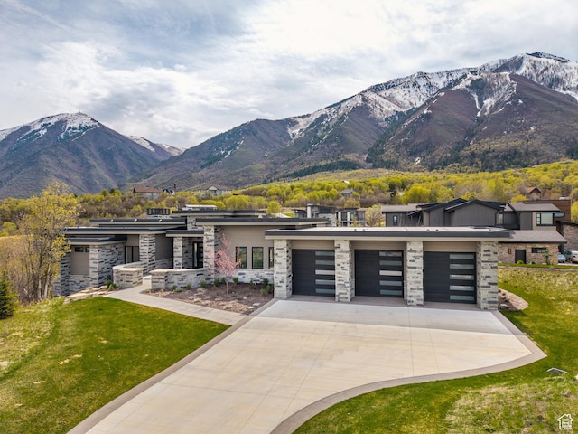 897 S Summit Creek Dr, Woodland Hills, UT 84653 - view of front facade featuring a mountain view, stone siding, and concrete driveway