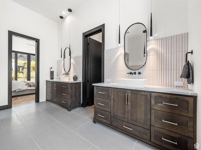 897 S Summit Creek Dr, Woodland Hills, UT 84653 - ensuite bathroom featuring tile patterned floors, two vanities, ensuite bathroom, and a sink