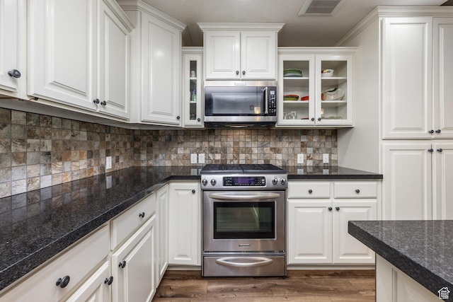 13386 N Alexis Dr, Kamas, UT 84036 - kitchen featuring appliances with stainless steel finishes, white cabinetry, and glass insert cabinets