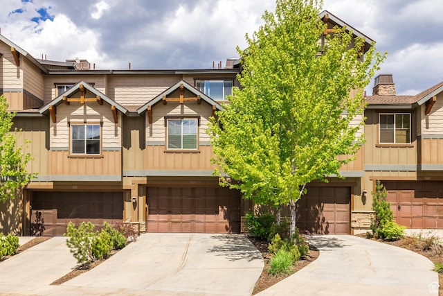 13386 N Alexis Dr, Kamas, UT 84036 - multi unit property featuring concrete driveway, board and batten siding, a garage, and a chimney