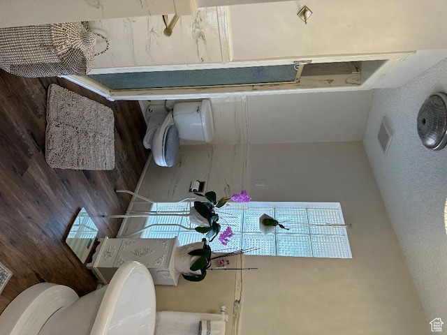 bathroom featuring visible vents and toilet