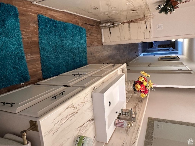 clothes washing area featuring laundry area and washing machine and dryer
