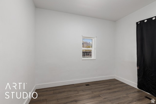 233 Patterson St, Ogden, UT 84401 - spare room featuring dark wood-style flooring and baseboards