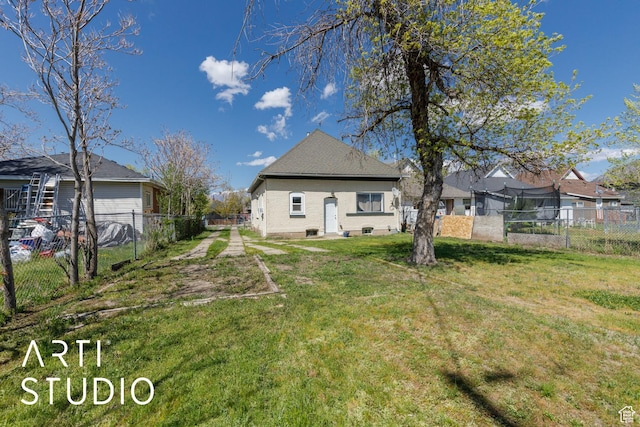 233 Patterson St, Ogden, UT 84401 - rear view of house with a residential view, a yard, and a fenced backyard
