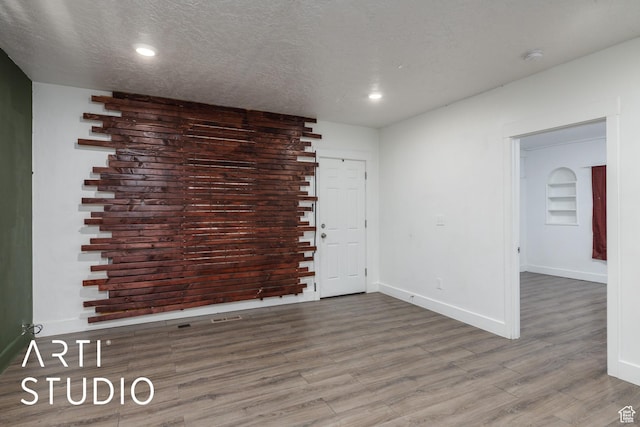 233 Patterson St, Ogden, UT 84401 - unfurnished room featuring recessed lighting, a textured ceiling, wood finished floors, and baseboards