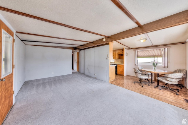 1575 Rocky Rd, Moab, UT 84532 - living area with beamed ceiling and light carpet