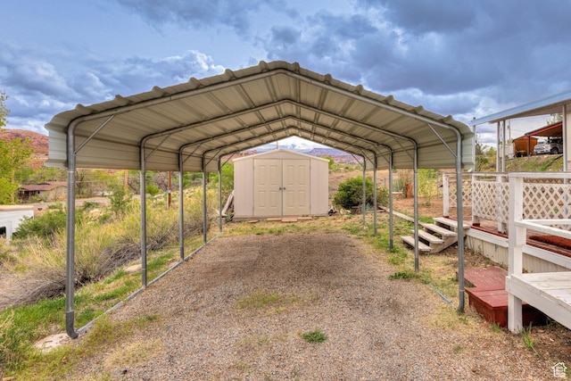 1575 Rocky Rd, Moab, UT 84532 - view of vehicle parking with a detached carport and a storage unit