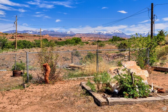 1575 Rocky Rd, Moab, UT 84532 - view of yard featuring fence and a mountain view