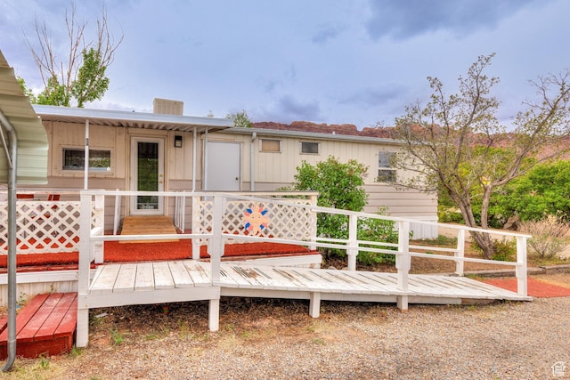 1575 Rocky Rd, Moab, UT 84532 - back of property with board and batten siding and a deck