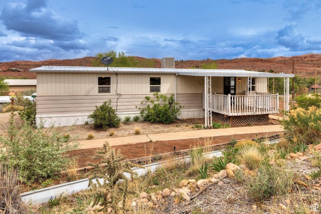1575 Rocky Rd, Moab, UT 84532 - rear view of property with a deck with mountain view