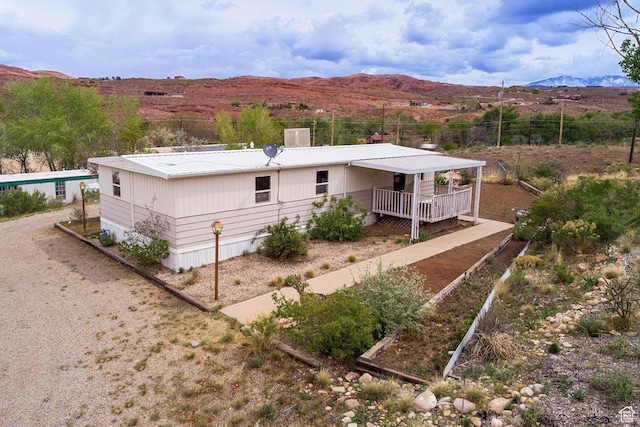 1575 Rocky Rd, Moab, UT 84532 - back of house with a mountain view and metal roof