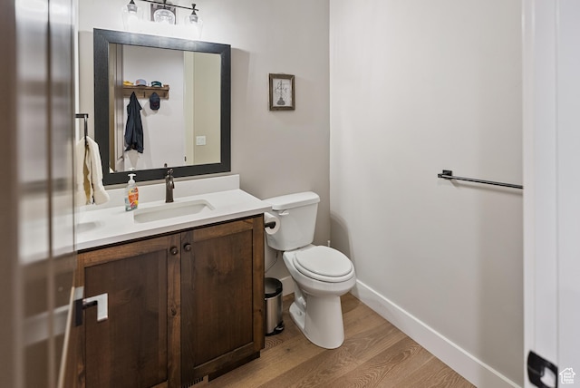 9313 E Deer Creek Dr S Unit 965, Heber City, UT 84032 - bathroom with baseboards, wood finished floors, toilet, and vanity