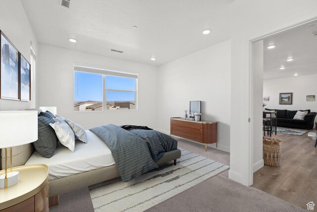 5801 S Garnet Dr Unit 2-301, St George, UT 84790 - bedroom featuring wood finished floors, visible vents, recessed lighting, and baseboards