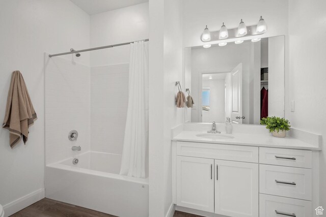 5801 S Garnet Dr Unit 2-301, St George, UT 84790 - bathroom with shower / tub combo, wood finished floors, vanity, and baseboards