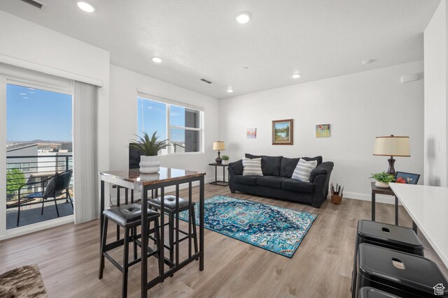 5801 S Garnet Dr Unit 2-301, St George, UT 84790 - living room featuring visible vents, recessed lighting, light wood finished floors, and baseboards