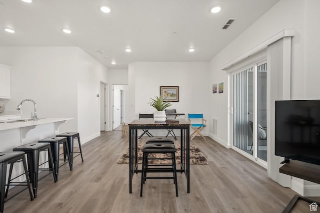 5801 S Garnet Dr Unit 2-301, St George, UT 84790 - dining space with baseboards, visible vents, and light wood-style floors