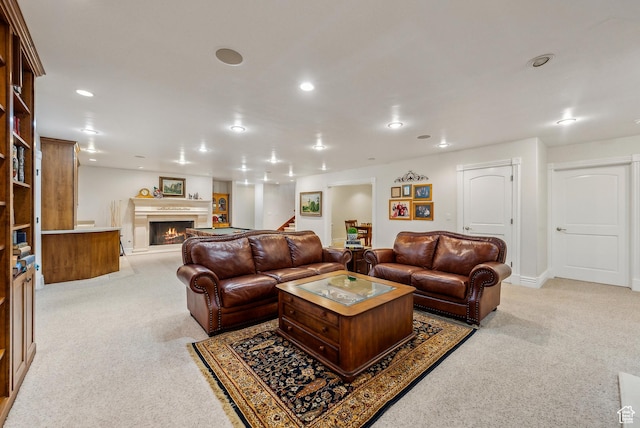 189 E Weber Canyon Rd, Oakley, UT 84055 - living room with recessed lighting, a warm lit fireplace, light colored carpet, and stairway