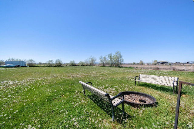 view of yard featuring fence and a rural view