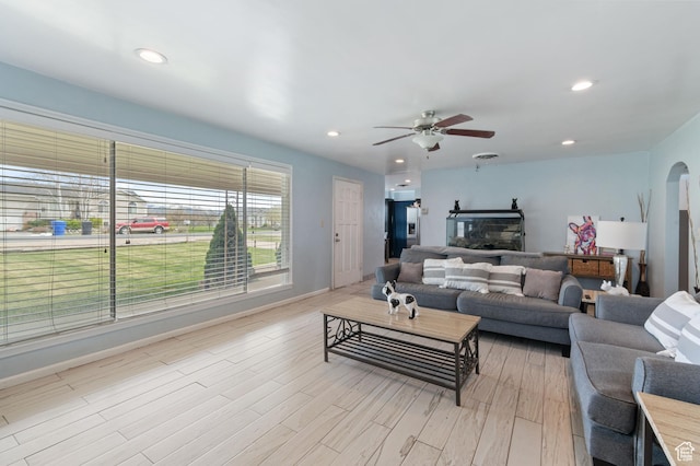 living room featuring light wood-type flooring, recessed lighting, and ceiling fan