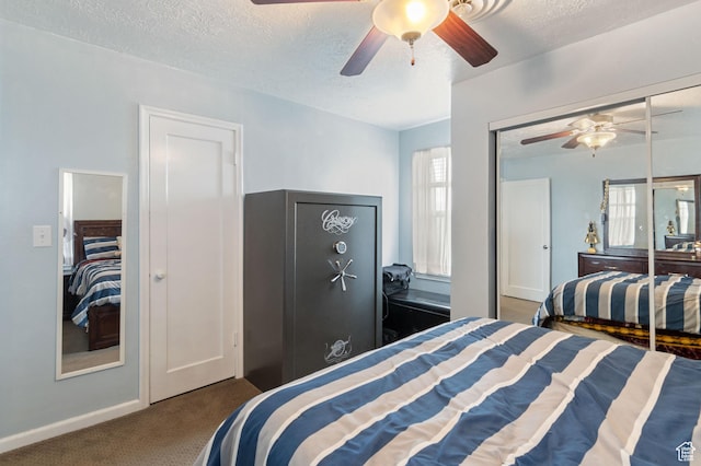 bedroom featuring carpet flooring, a ceiling fan, a textured ceiling, and baseboards