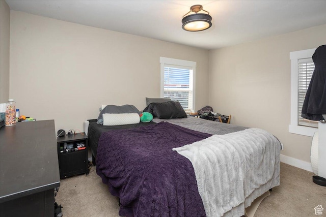 3048 S Harrison Blvd, Ogden, UT 84403 - bedroom featuring baseboards and light colored carpet