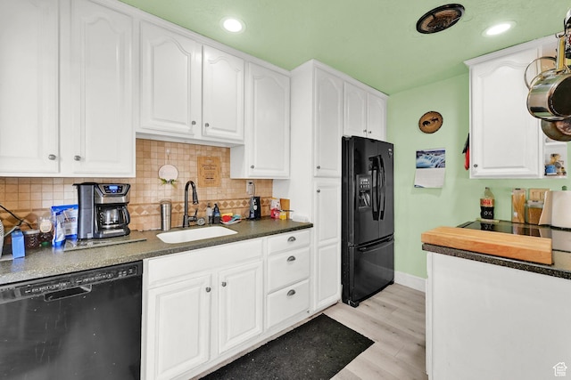 162 Mond St, Ogden, UT 84404 - kitchen with white cabinets, black appliances, light wood-style flooring, and a sink