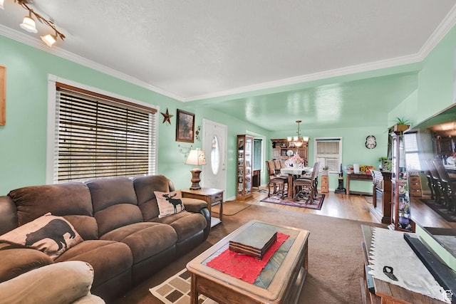 162 Mond St, Ogden, UT 84404 - living area featuring ornamental molding, a notable chandelier, and wood finished floors