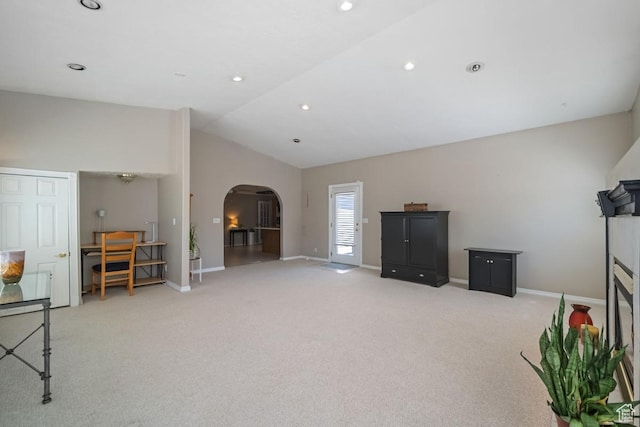 2009 W 7455 S, West Jordan, UT 84084 - interior space featuring baseboards, arched walkways, lofted ceiling, and light colored carpet
