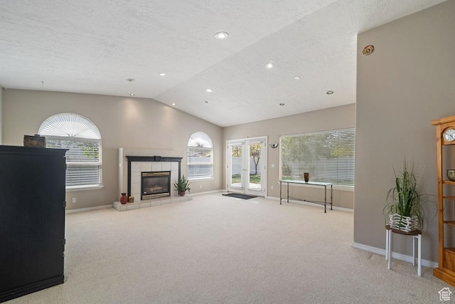 2009 W 7455 S, West Jordan, UT 84084 - unfurnished living room with carpet flooring, a wealth of natural light, lofted ceiling, and baseboards