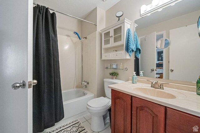 2009 W 7455 S, West Jordan, UT 84084 - ensuite bathroom with ensuite bath, tile patterned floors, toilet, vanity, and shower / tub combo with curtain