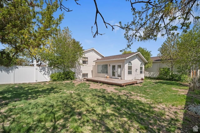 2009 W 7455 S, West Jordan, UT 84084 - back of house featuring a wooden deck, a gate, a yard, french doors, and a fenced backyard