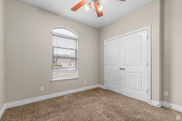 2254 N 1560 W, Pleasant Grove, UT 84062 - unfurnished bedroom with carpet, baseboards, a ceiling fan, and a closet