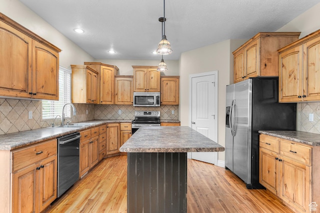 2254 N 1560 W, Pleasant Grove, UT 84062 - kitchen with a center island, light wood-style floors, appliances with stainless steel finishes, and a sink