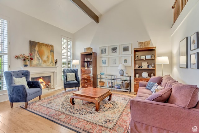 1605 E 6535 S, Murray, UT 84121 - living room with a fireplace, beam ceiling, wood finished floors, and high vaulted ceiling