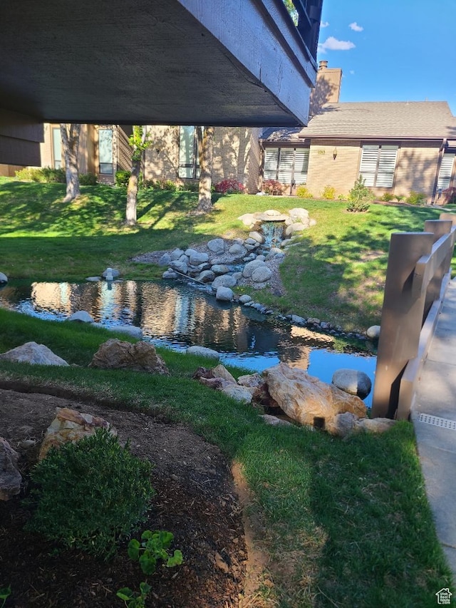 1605 E 6535 S, Murray, UT 84121 - view of grassy yard with a small pond