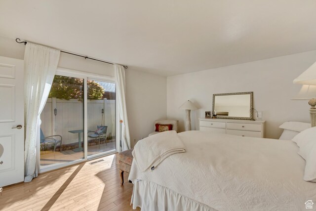 1605 E 6535 S, Murray, UT 84121 - bedroom with access to outside and hardwood / wood-style floors