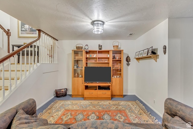 1605 E 6535 S, Murray, UT 84121 - living area with carpet floors, stairway, baseboards, and a textured ceiling