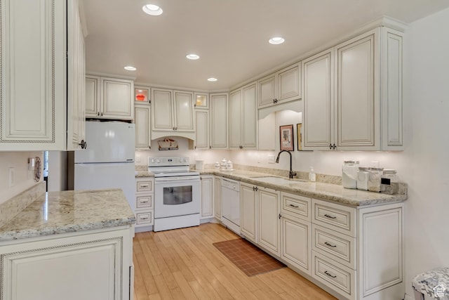 1605 E 6535 S, Murray, UT 84121 - kitchen with white appliances, a sink, light stone counters, light wood-type flooring, and recessed lighting