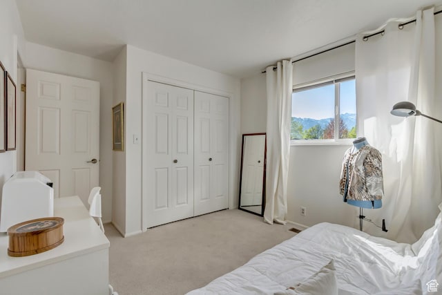 1605 E 6535 S, Murray, UT 84121 - bedroom with light carpet, a closet, baseboards, and a mountain view