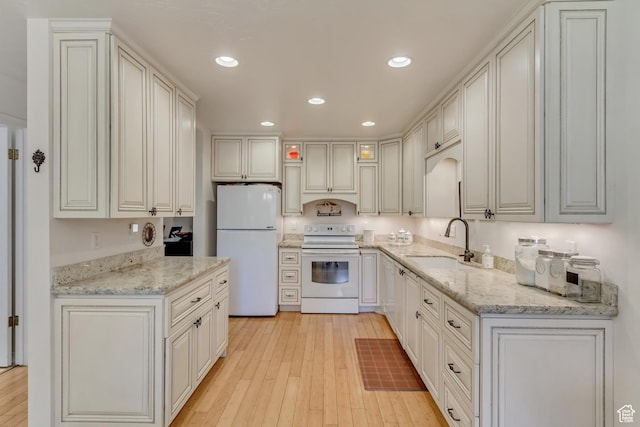 1605 E 6535 S, Murray, UT 84121 - kitchen with white appliances, a sink, light wood finished floors, light stone counters, and recessed lighting